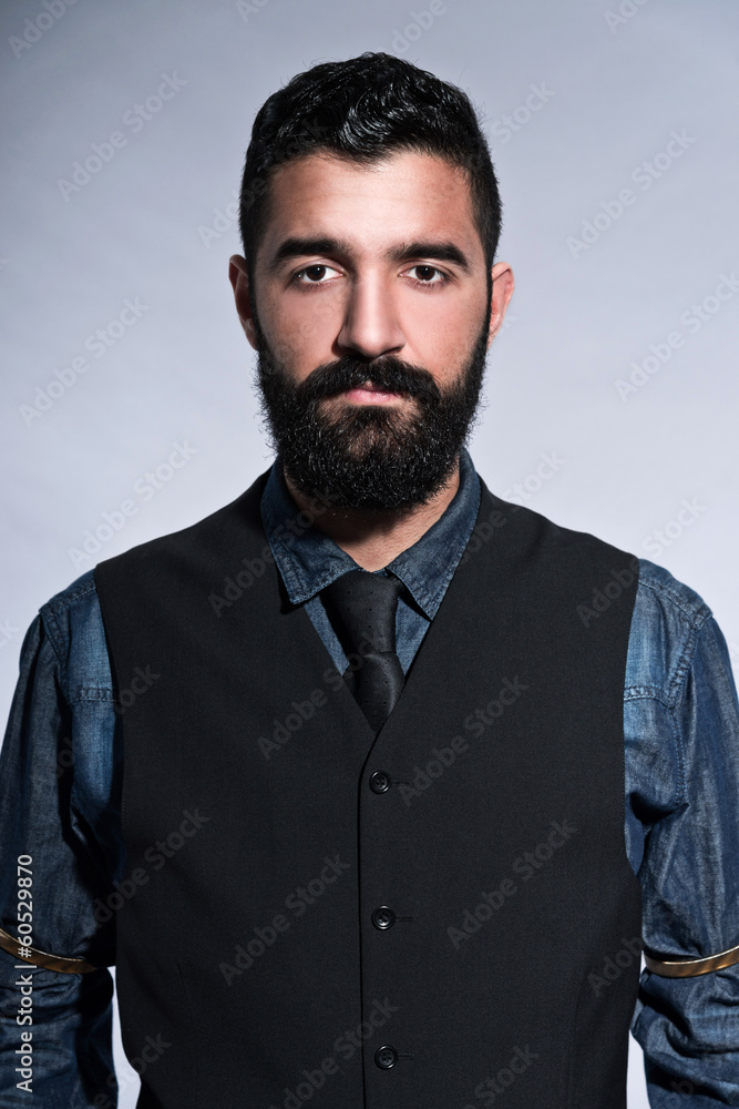 Retro hipster 1900 fashion man in suit with black hair and beard Retro hipster 1900 fashion man in suit with black hair and beard