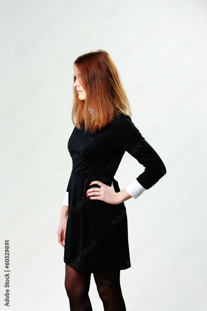 Side view portrait of a young woman on gray background Side view portrait of a young woman on gray background