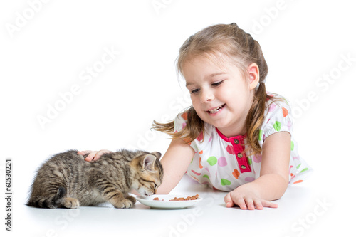 happy child feeding kitten