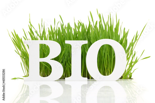 Word "Bio" with fresh grass isolated on white