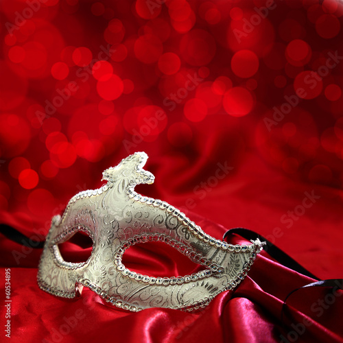 Vintage venetian carnival mask on red background
