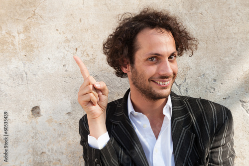 portrait of cheerful young man, wall background photo