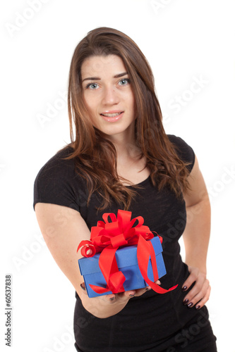 smiling girl holding blue gift box with red ribbon © dechevm