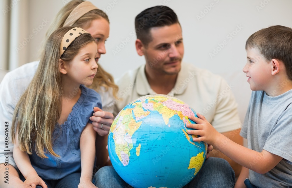 Family with globe in house Family with globe in house