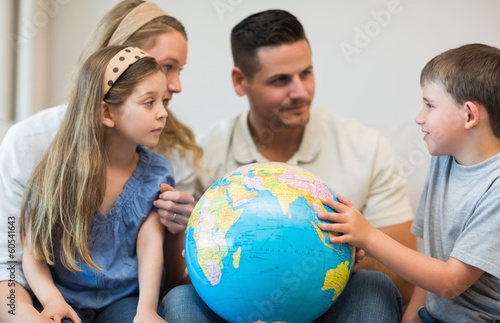 Family with globe in house