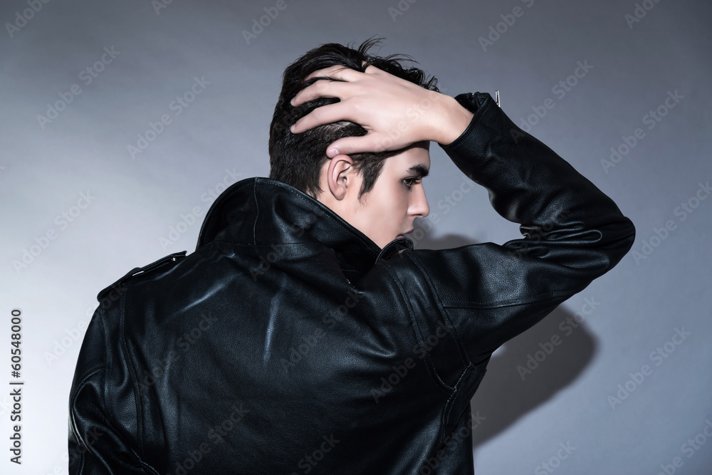 Cool retro rock and roll 50s fashion man. Hand in his hair. Wear Cool retro rock and roll 50s fashion man. Hand in his hair. Wear