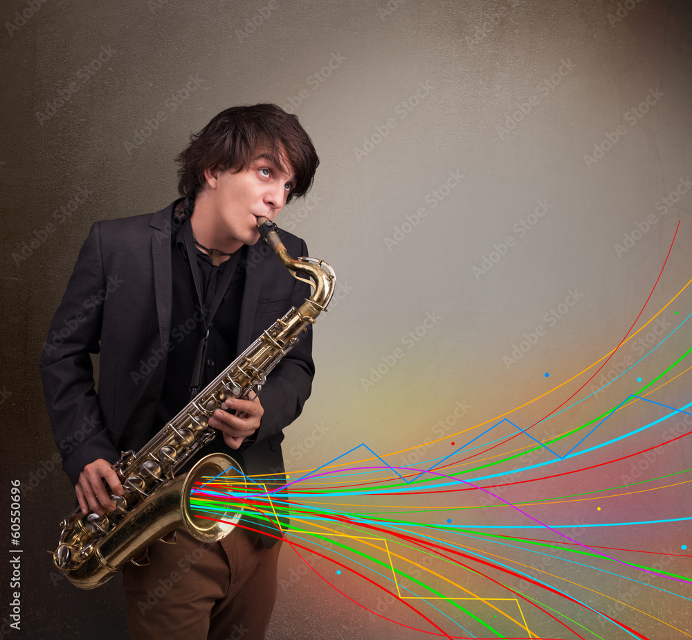 Naklejka premium Attractive musician playing on saxophone while colorful abstract