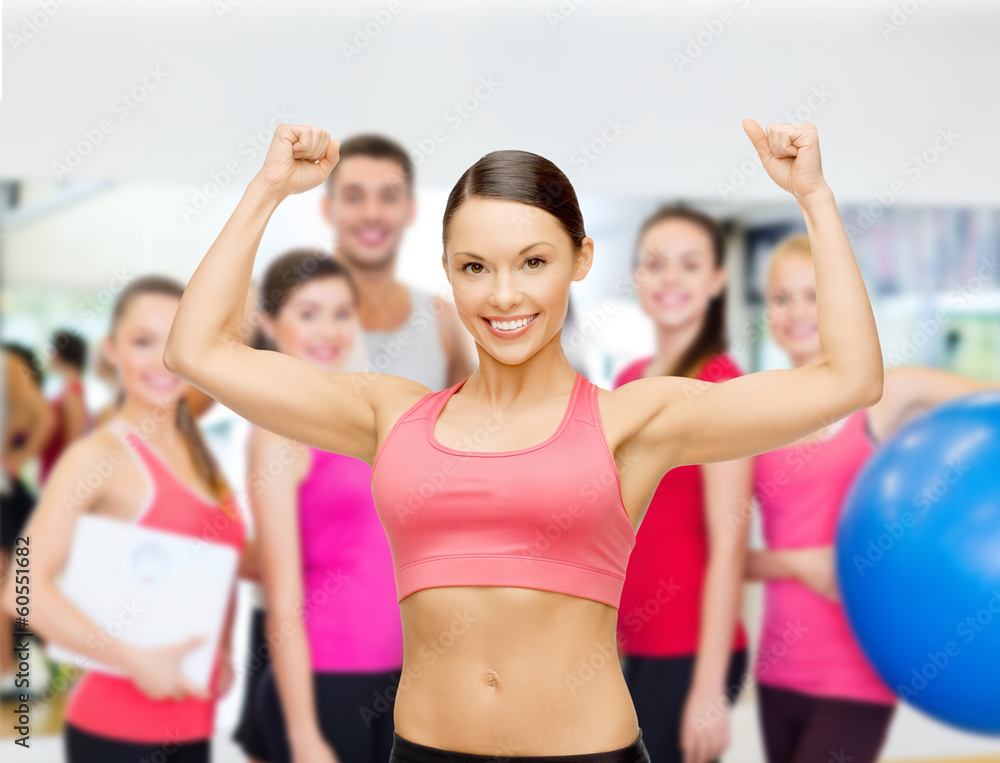 personal trainer with group in gym personal trainer with group in gym
