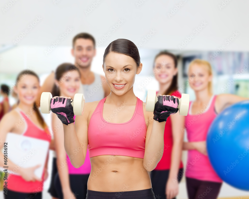 personal trainer with group in gym personal trainer with group in gym