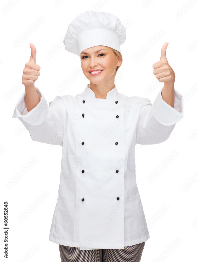 smiling female chef showing thumbs up smiling female chef showing thumbs up
