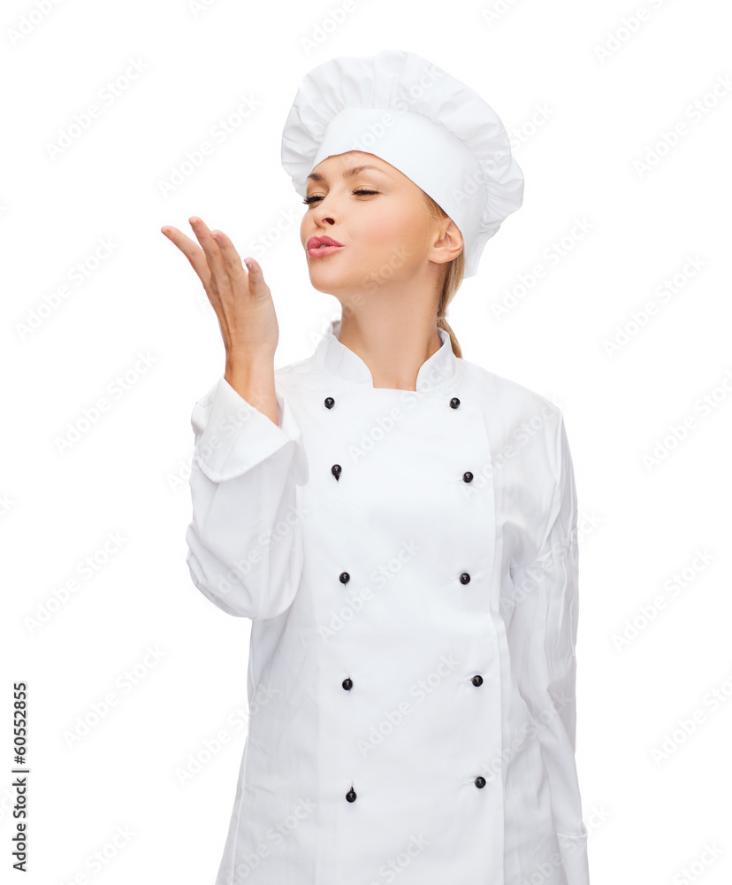 smiling female chef showing delicious sign smiling female chef showing delicious sign