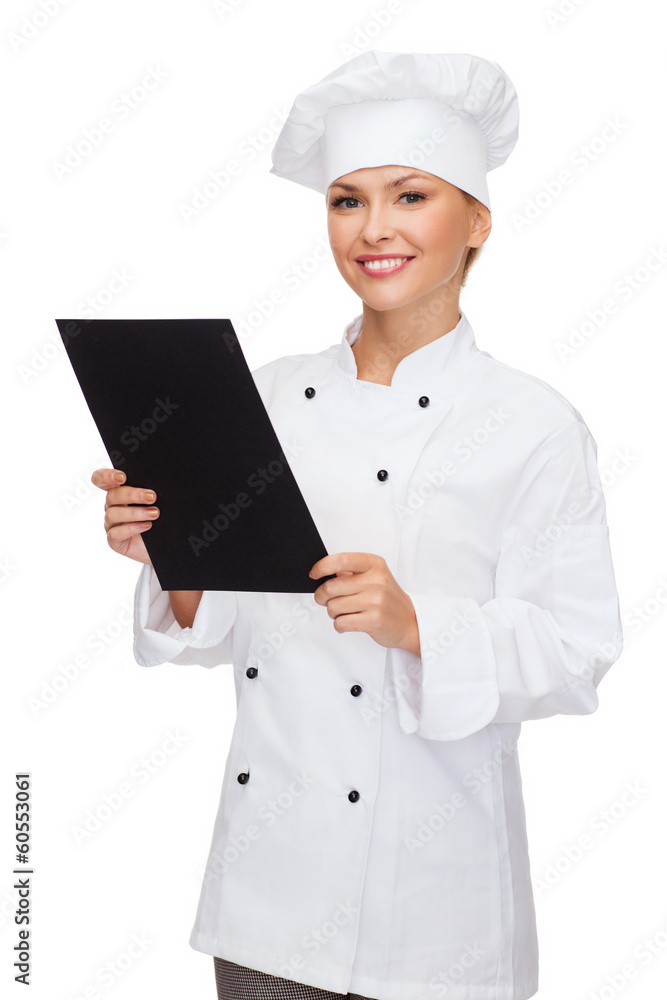 smiling female chef with black blank paper smiling female chef with black blank paper