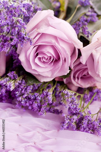 beautiful lavander and pink rose on bright background