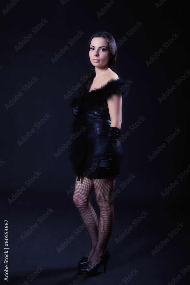 Young woman in a leather black dress