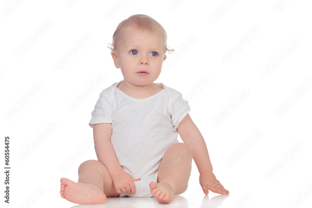Adorable blonde baby in underwear sitting on the floor Adorable blonde baby in underwear sitting on the floor