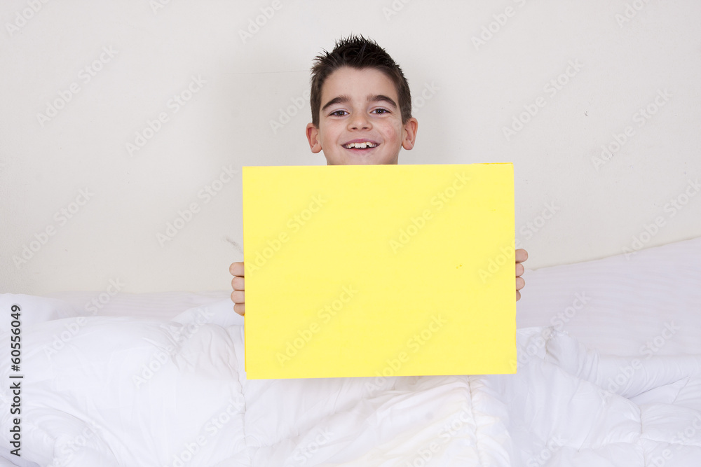 cute little boy with expressions in bed cute little boy with expressions in bed