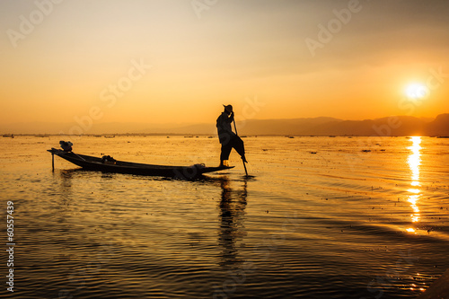 A local fisherman is travelling by boat, Inle lake, Myanmar.