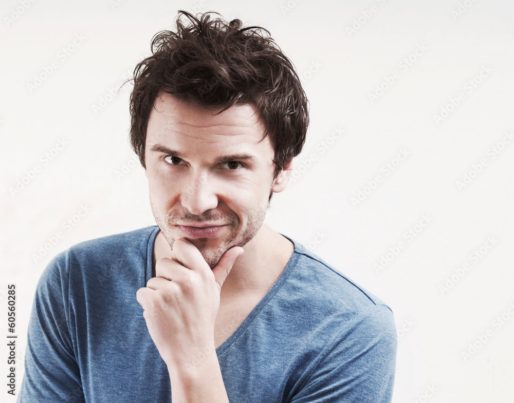 Portrait of young man pointing at you Portrait of young man pointing at you