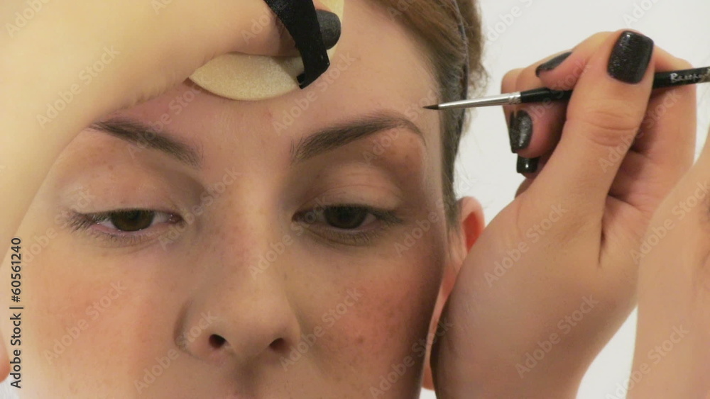 Beauty woman having her made up by stylist Beauty woman having her made up by stylist