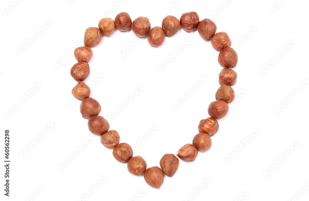 Valentine heart of hazelnut on white background Valentine heart of hazelnut on white background