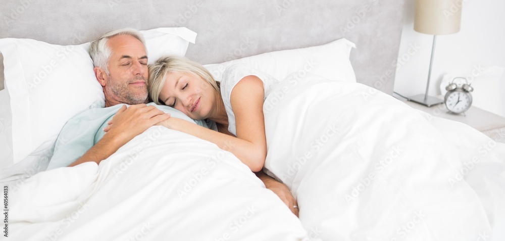 Loving mature man and woman lying in bed Loving mature man and woman lying in bed