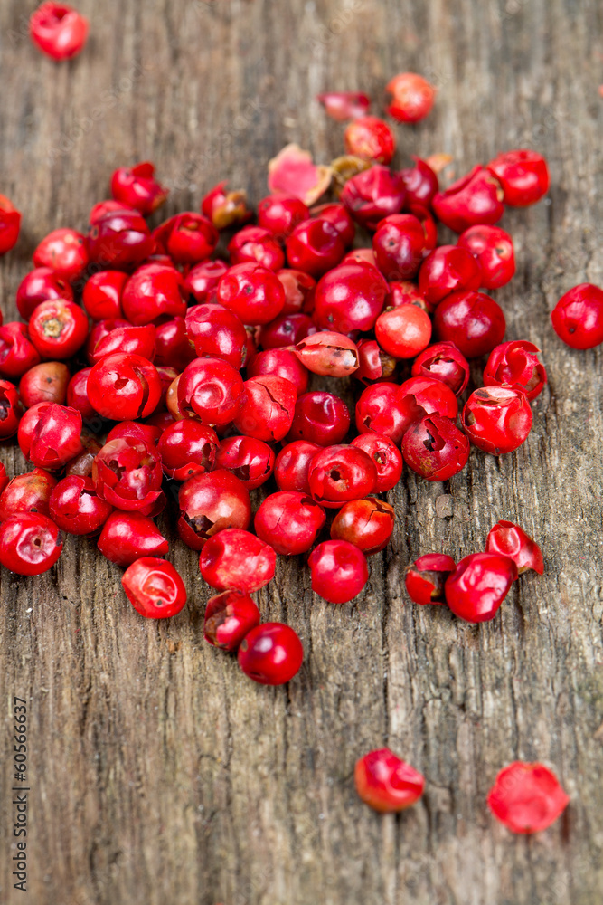 pink peppercorn on wooden background pink peppercorn on wooden background
