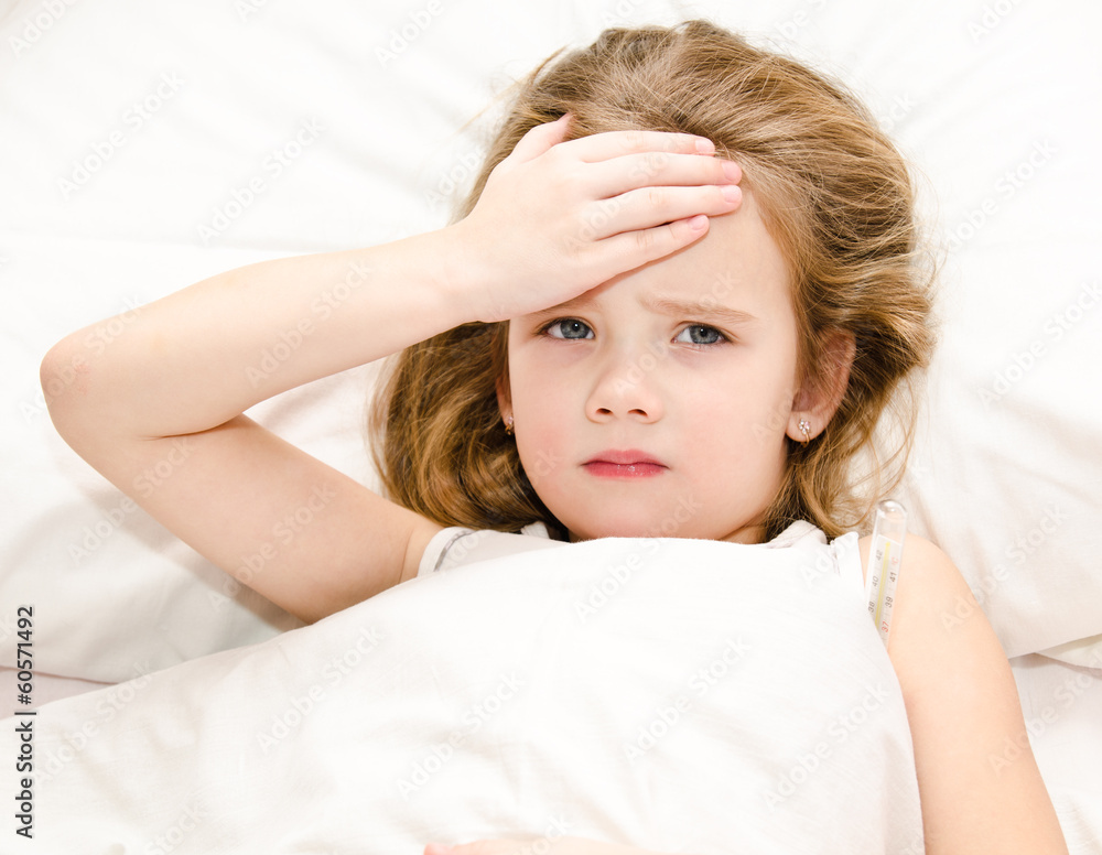 Fototapeta premium Sick little girl lying in the bed