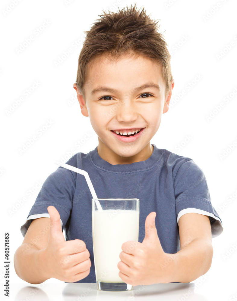 Cute boy with a glass of milk