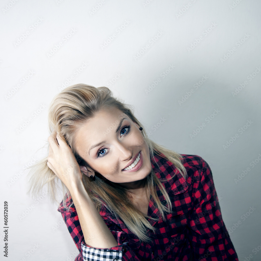 Fototapeta premium Smiling cheerful blonde gitl.