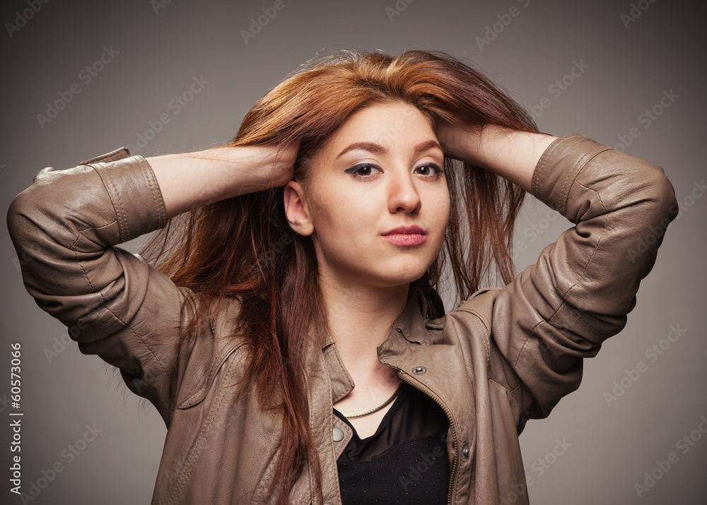 Girl in a leather jacket represents model Girl in a leather jacket represents model