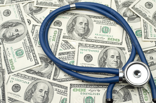 heap of dollars with stethoscope