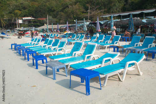 beach chairs with white umbrella
