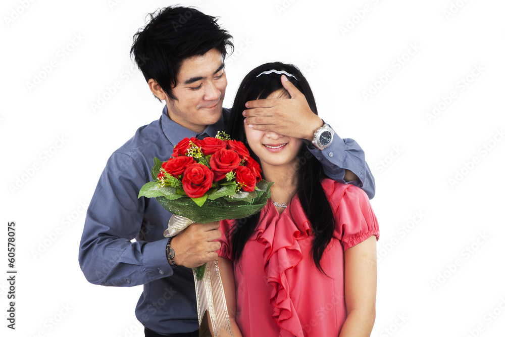 A man giving flowers to woman