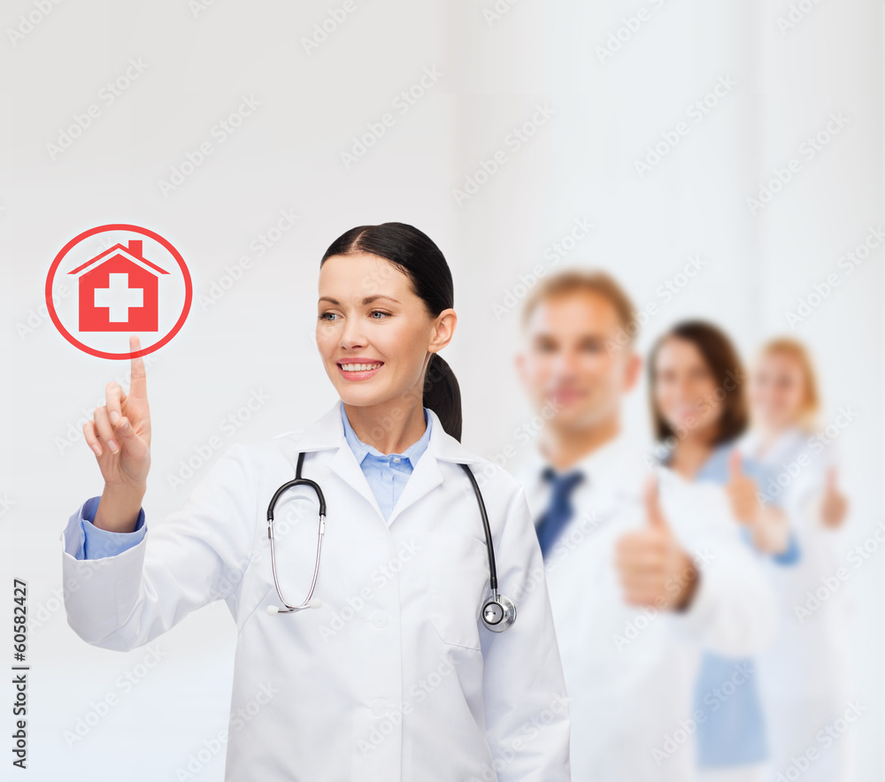 smiling female doctor pointing to something smiling female doctor pointing to something