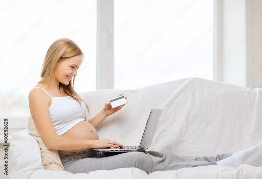 smiling pregnant woman with laptop computer smiling pregnant woman with laptop computer