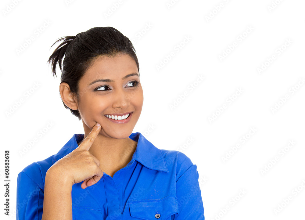 Happy young woman looking upwards daydreaming Happy young woman looking upwards daydreaming