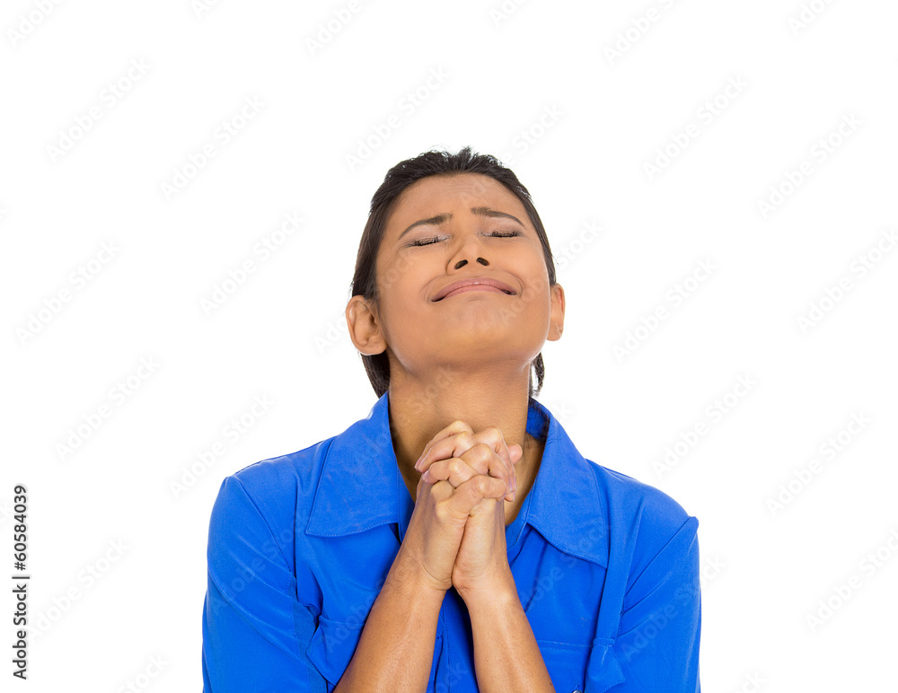 Woman eyes closed praying hoping for the best Woman eyes closed praying hoping for the best