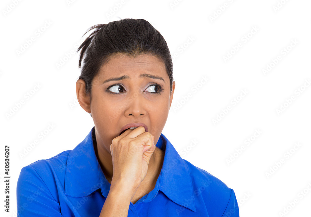 Obsessive woman biting her hand, looking to side anxiously Obsessive woman biting her hand, looking to side anxiously