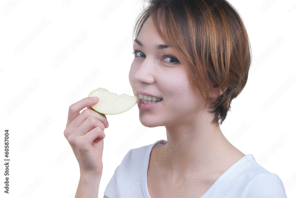 Pretty young girl with piece of green apple Pretty young girl with piece of green apple