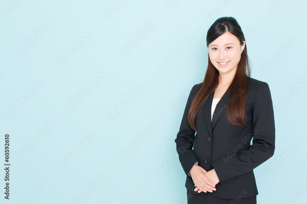 young asian businesswoman on blue background young asian businesswoman on blue background