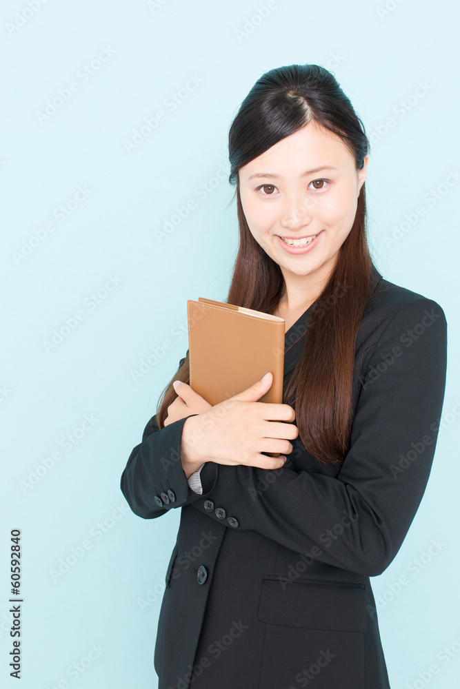 young asian businesswoman on blue background young asian businesswoman on blue background