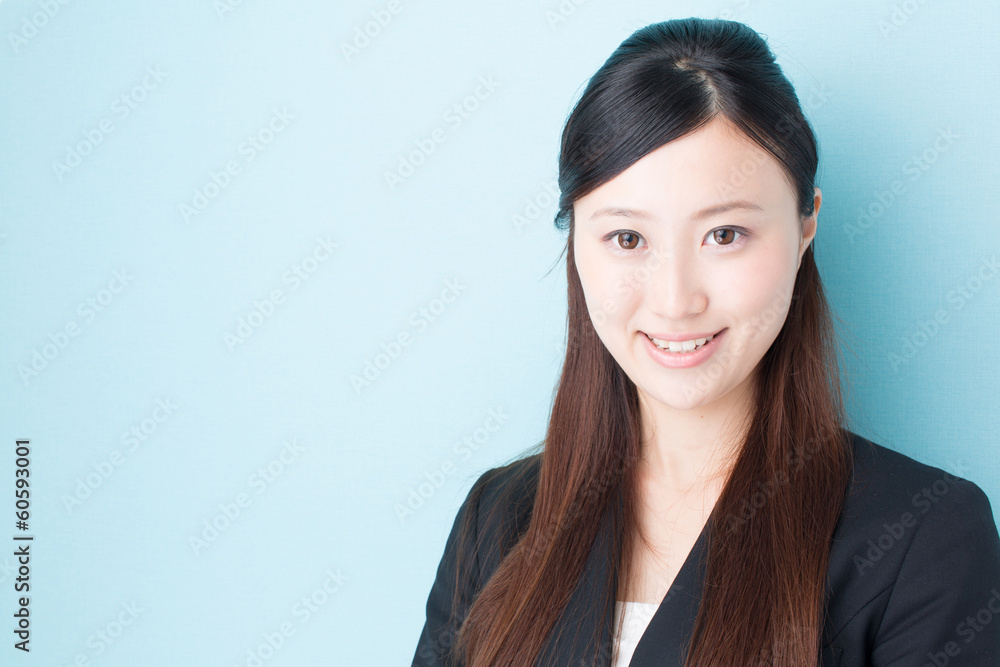 young asian businesswoman on blue background young asian businesswoman on blue background