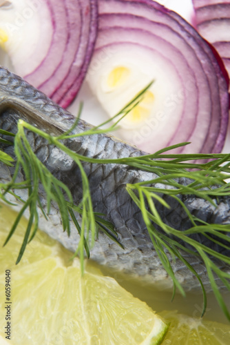 Fillet herring with onion and lemon photo