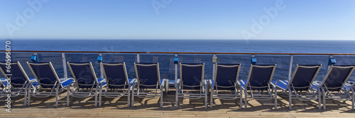 Lounge chairs on deck of luxury cruise ship © Mariusz Blach