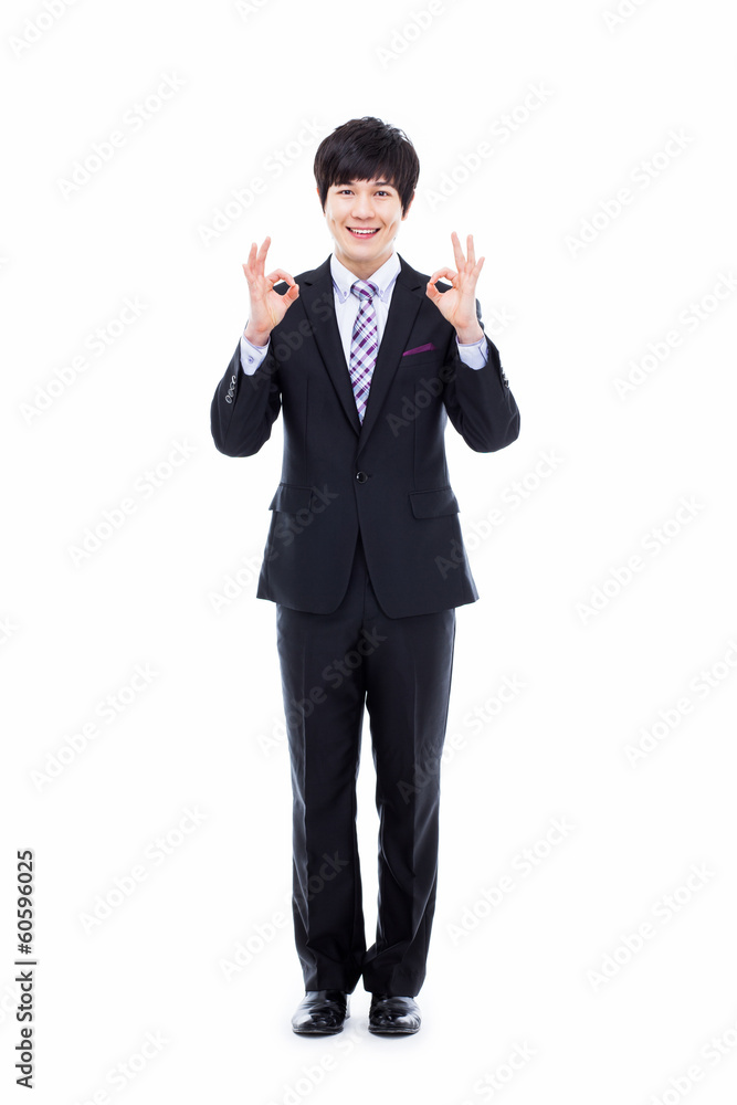 Showing thumb young Asian business man. Showing thumb young Asian business man.