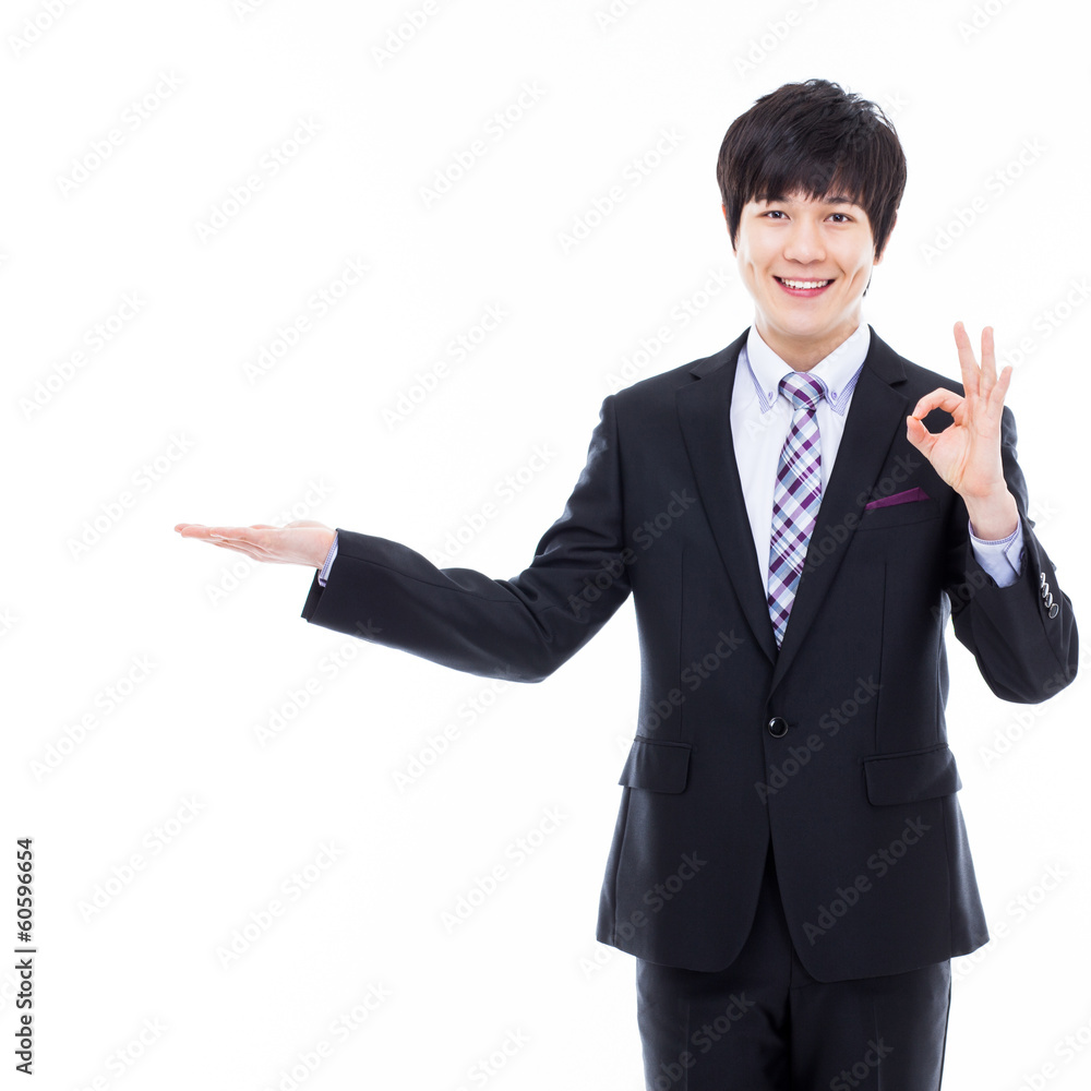 Young Asian business man showing something Young Asian business man showing something