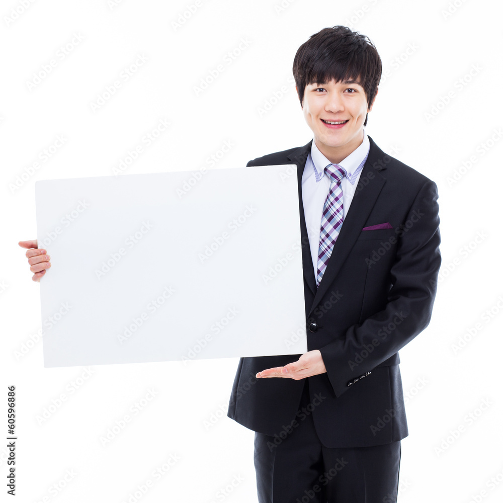 Young Asian business man holding a blank banner Young Asian business man holding a blank banner