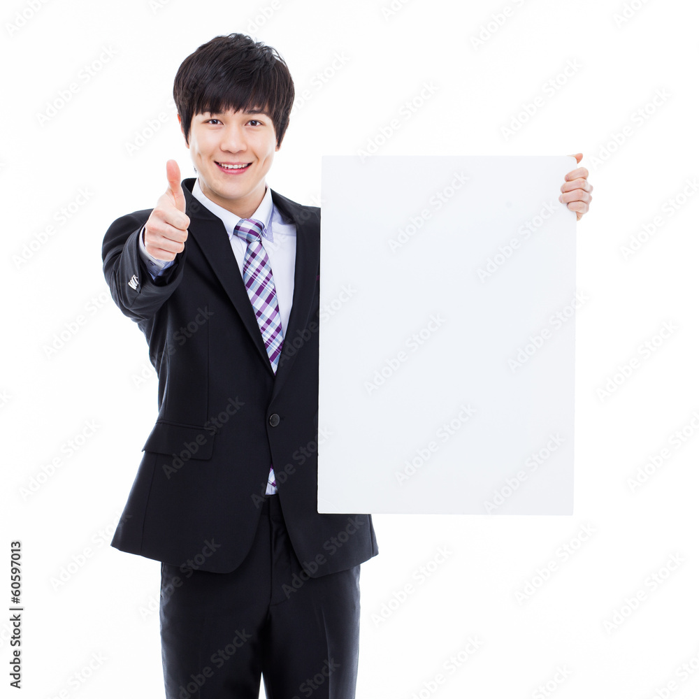 Young Asian business man holding a blank banner Young Asian business man holding a blank banner
