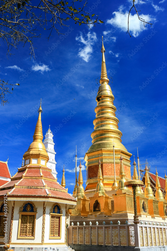 Fototapeta premium Beautiful golden pagoda under deep blue sky