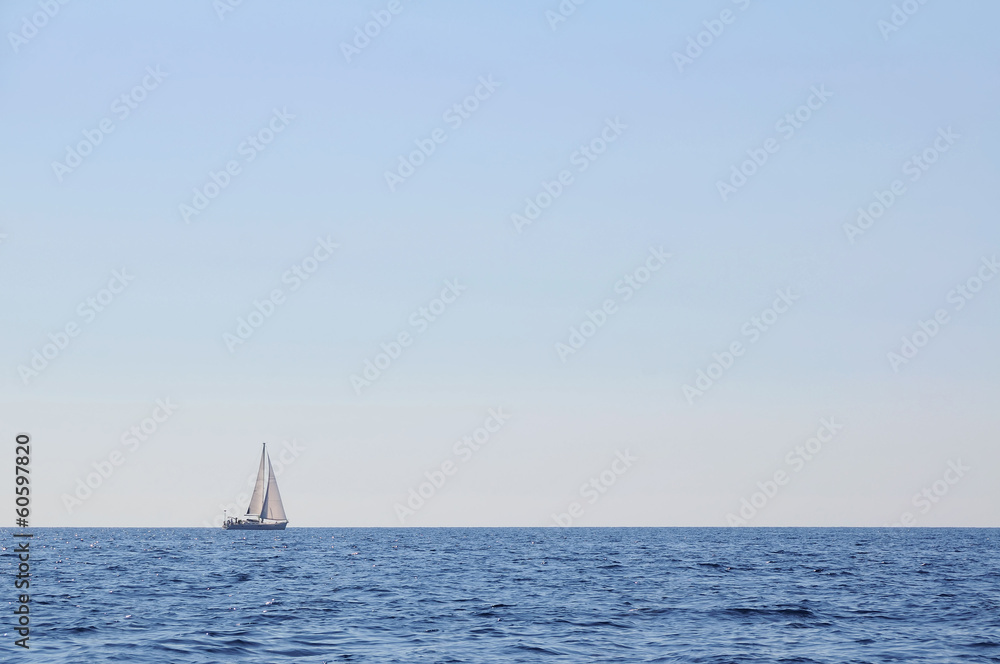 Sailboat alone at open sea